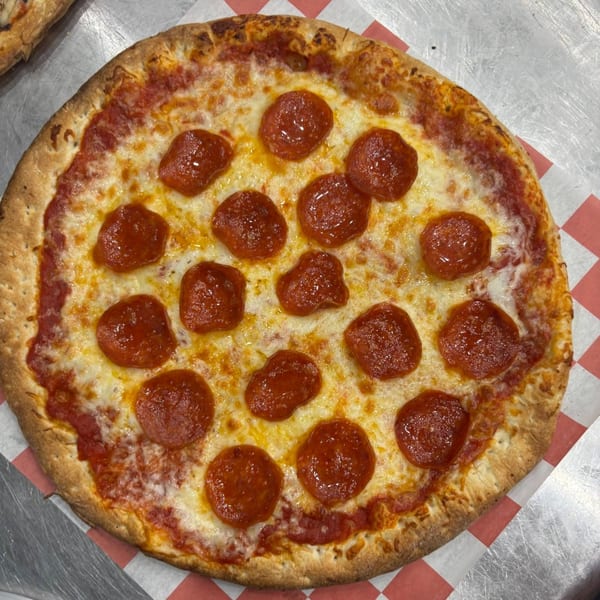 A whole pepperoni pizza from FYRE PIZZA Co. with melted cheese and a crispy crust.